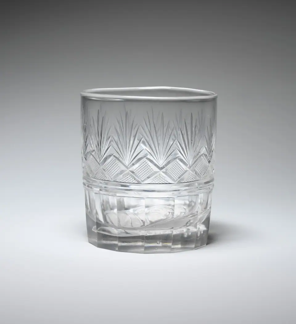 An American cut glass tumbler made by Bakewell, Page and Bakewell about 1825, with fan and diamond cutting and a cameo set in the base